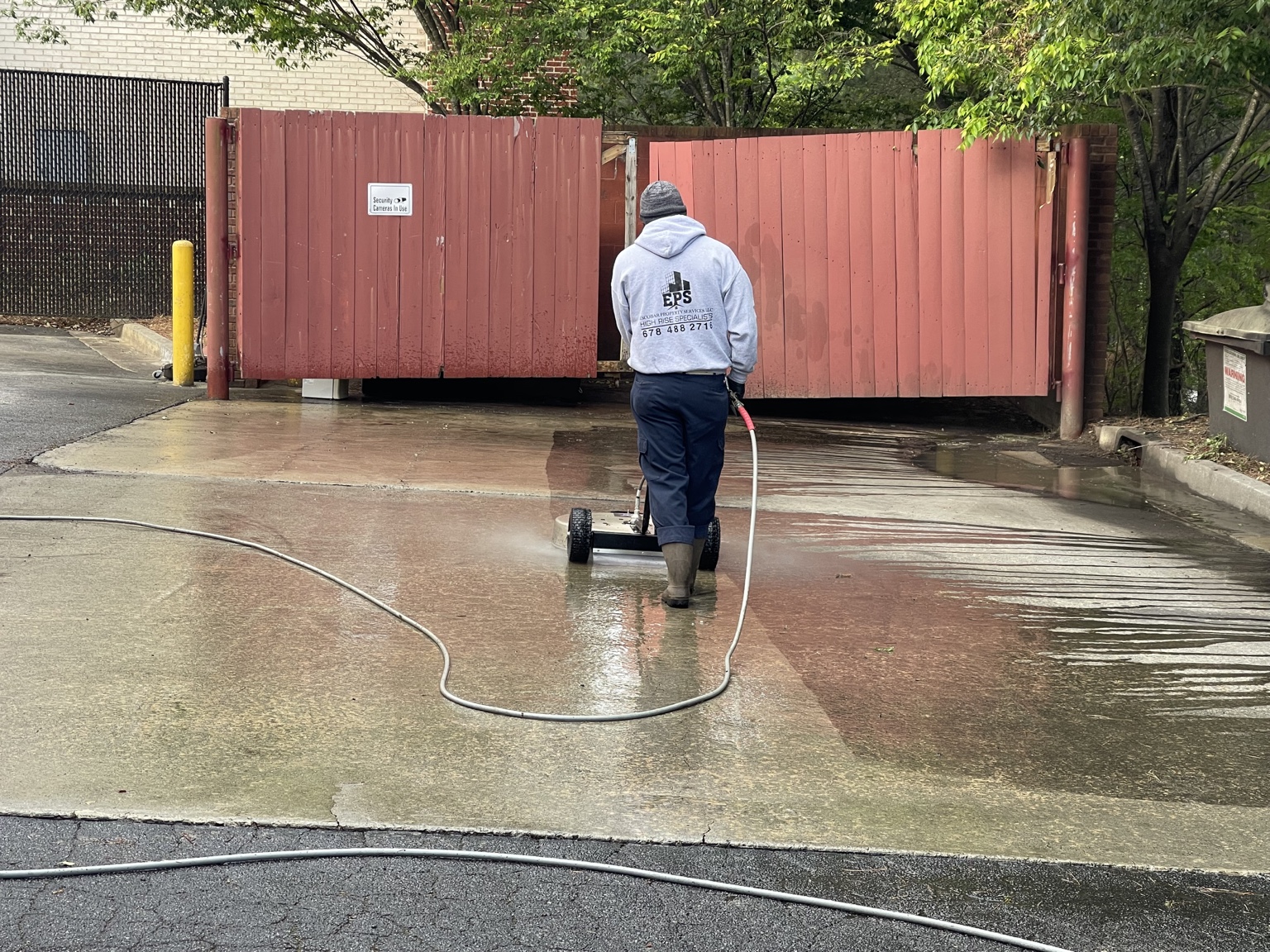 Commercial dumpster pad cleaning