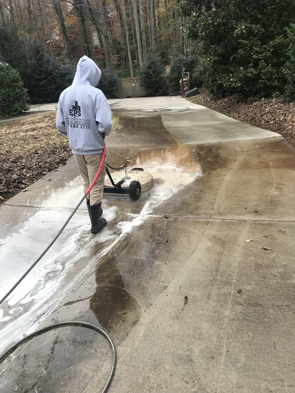 Driveway before pressure washing